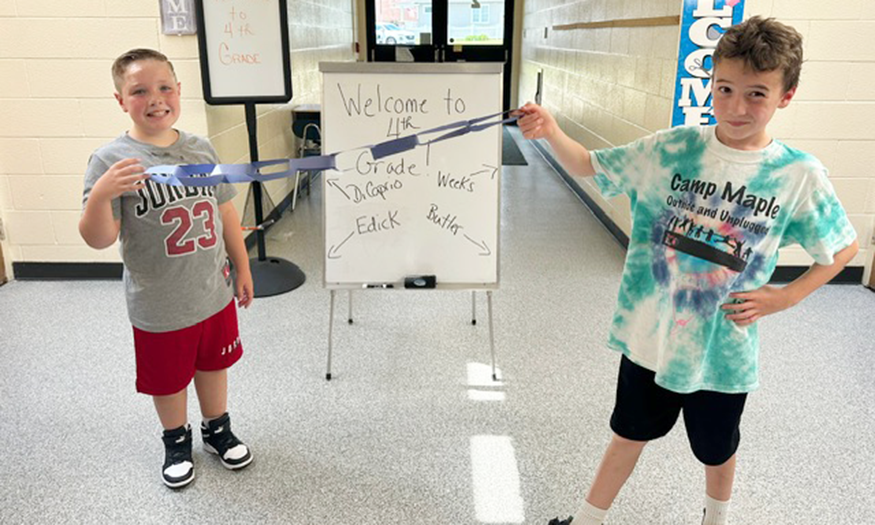 Students show off paper chain