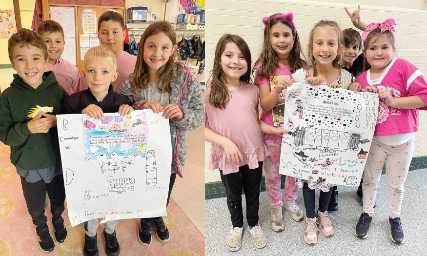 Students pose for photo with math posters