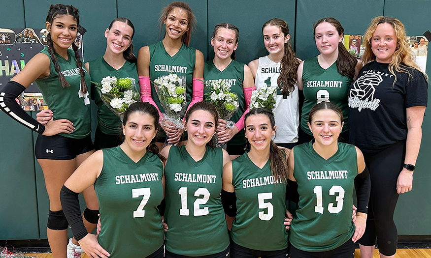 Volleyball team poses for photo