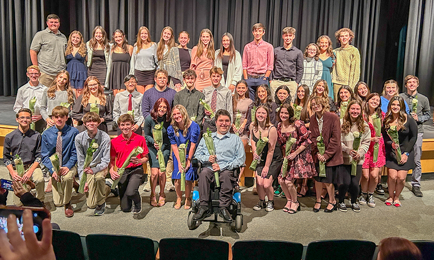 Group photo of students on stage