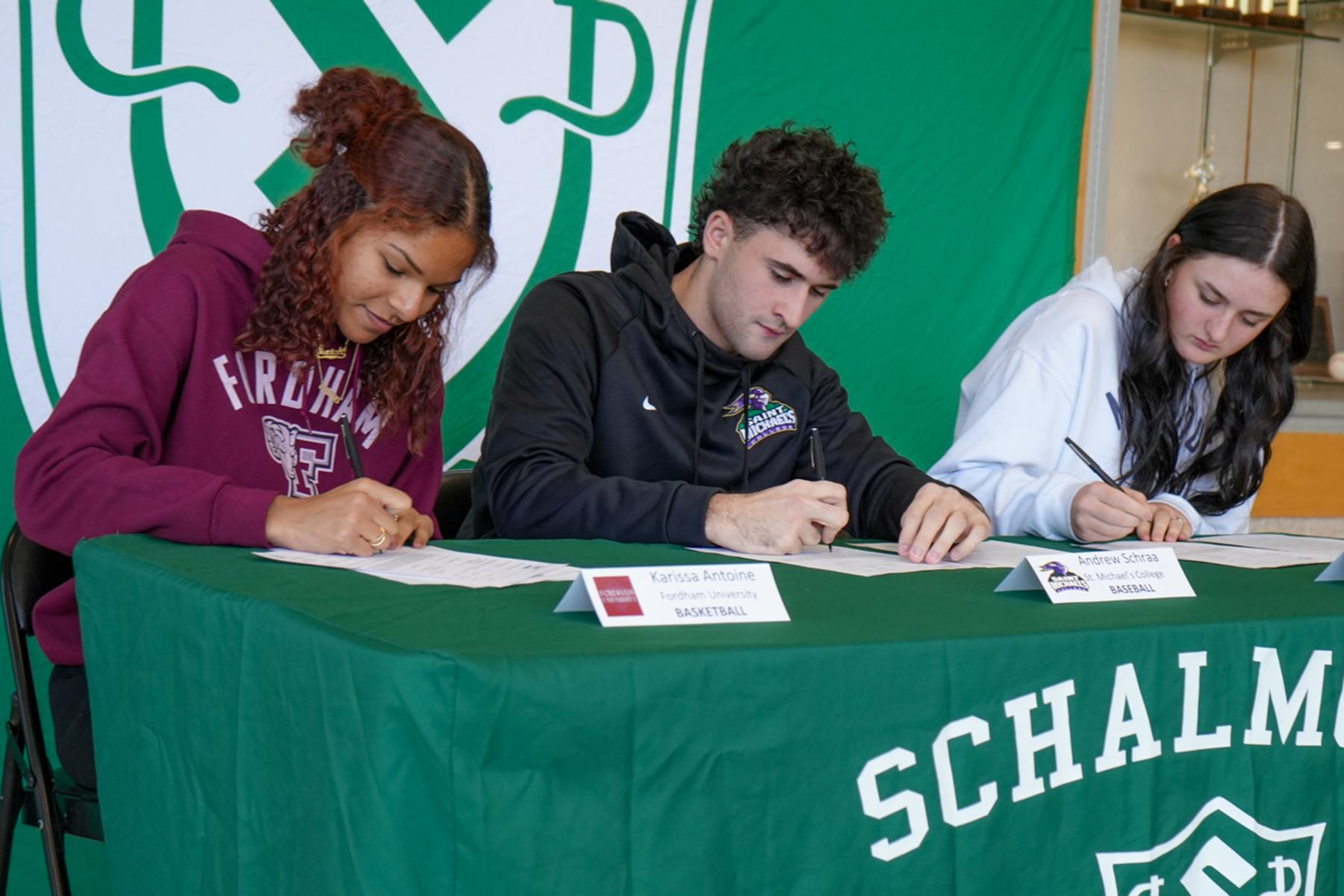 Three students sign letters of intent