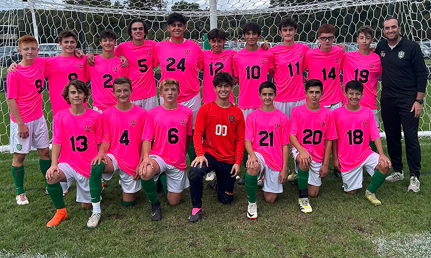 Group photo of soccer team in pink