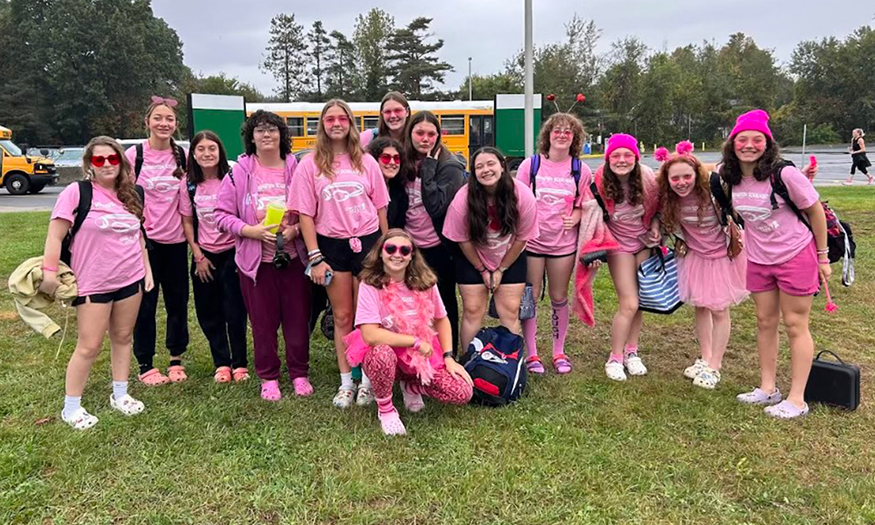 Group photo of swim team in pink