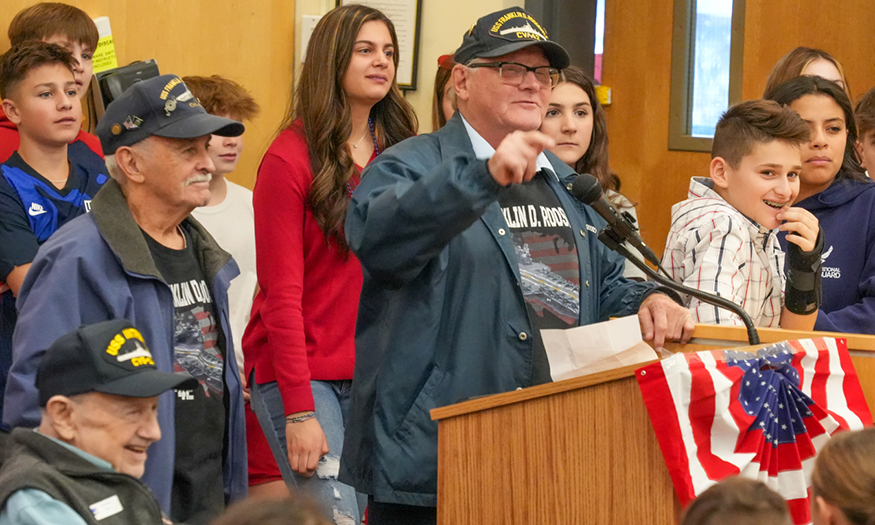 Veteran speaks at podium