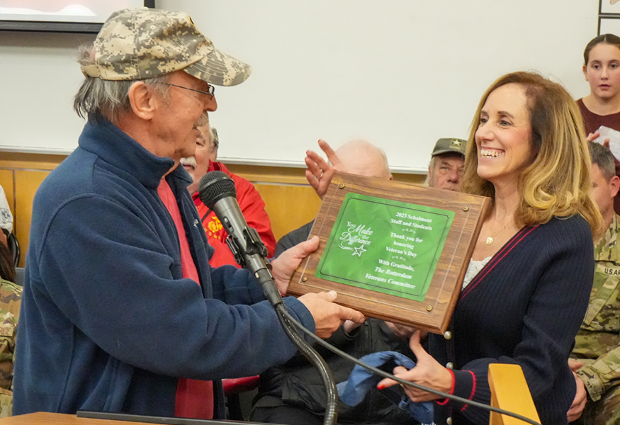 Veteran gives plaque to staff member