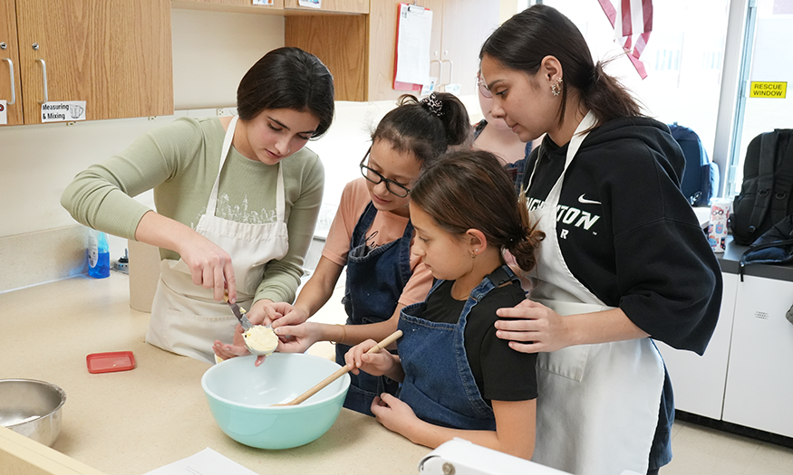 Students make cookies together