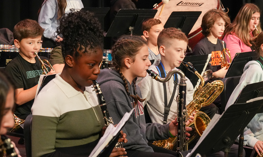 Students perform on instruments