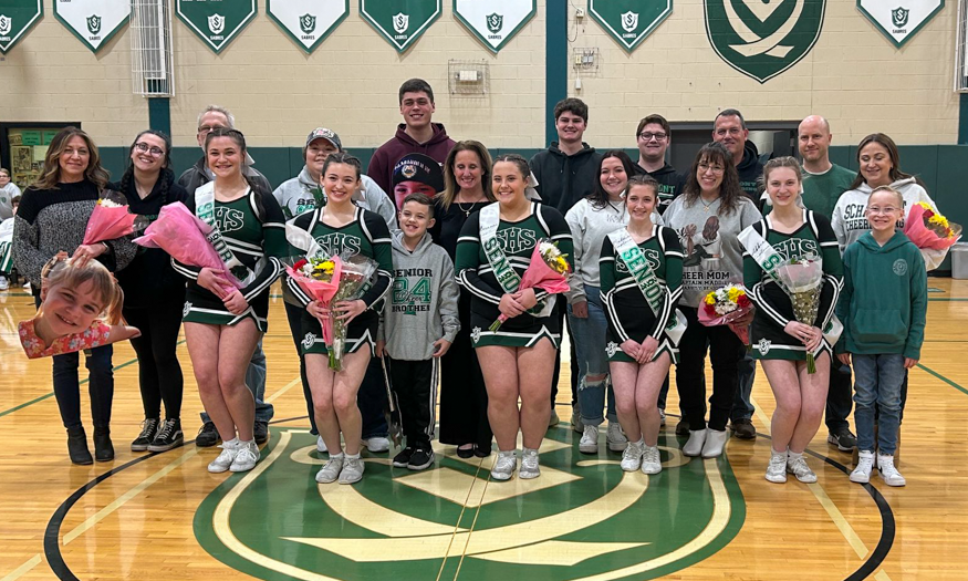 Senior cheerleaders pose for photo