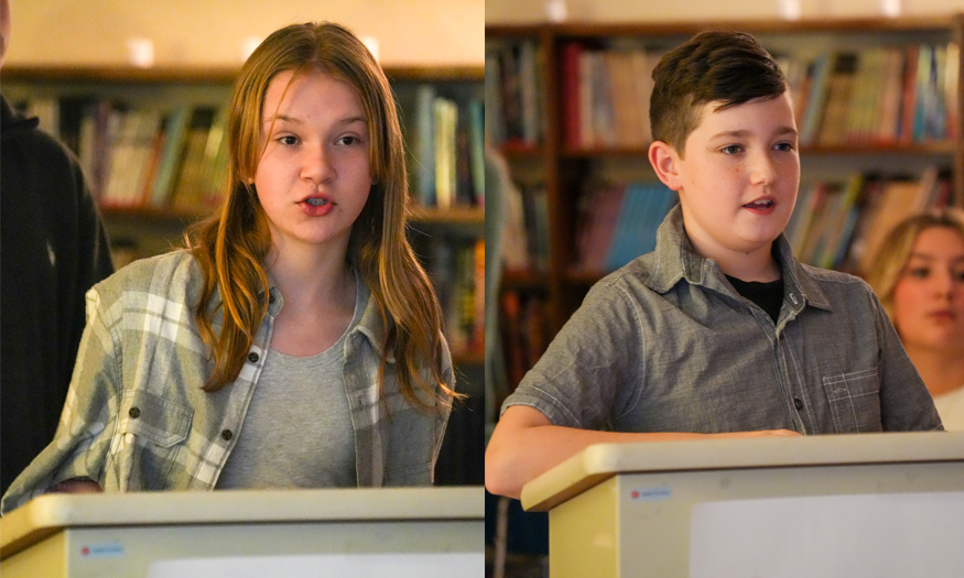 Students debate at podiums