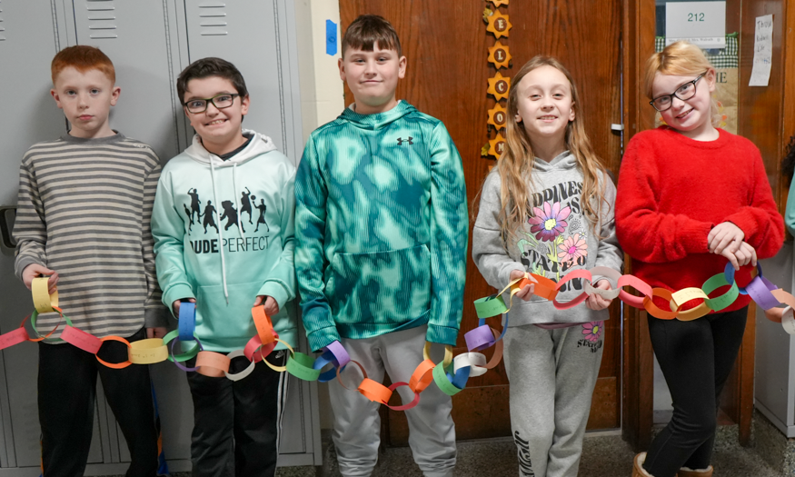 Students hold paper chain