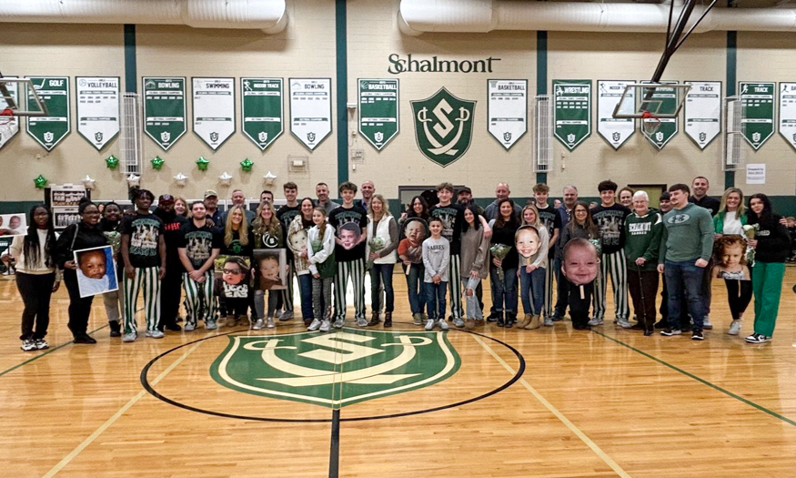 Group photo of basketball seniors and families