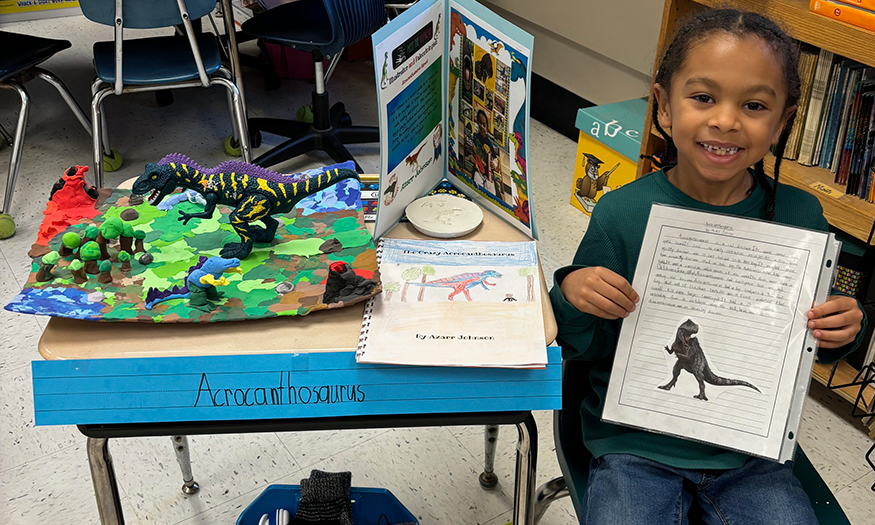 Student with dinosaur project