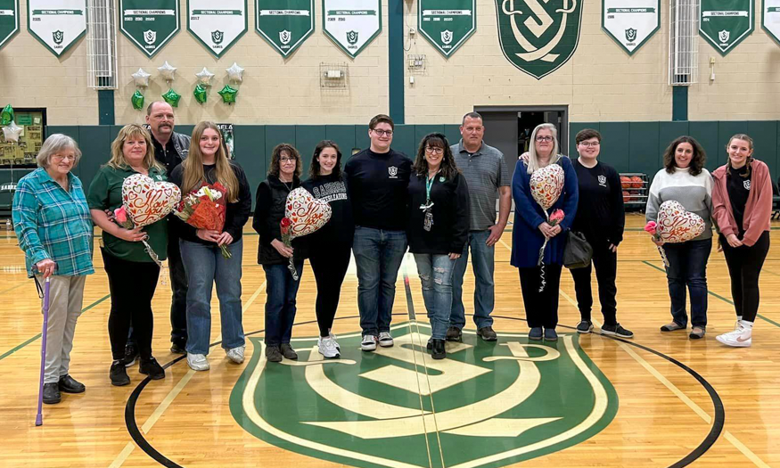 Group photo of families in gym