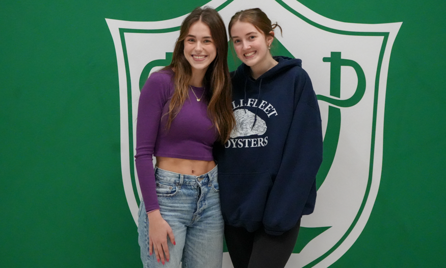 Two students pose for photo