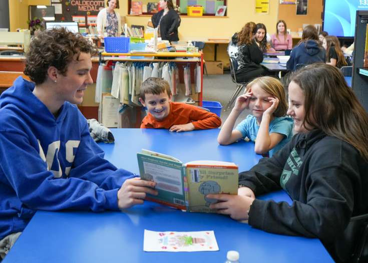 Students read to younger students