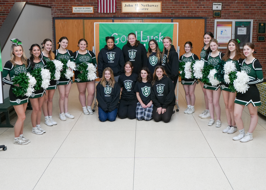 Group photo of bowling team and cheerleaders