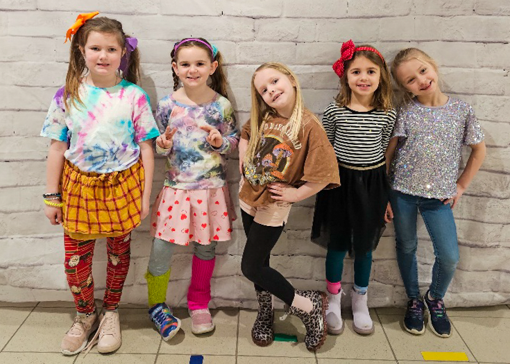 Students pose for photo in mismatched clothes