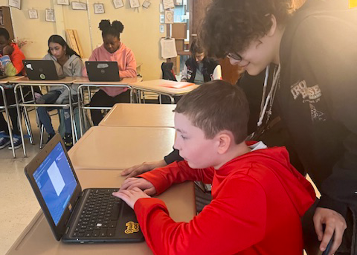 Students work on Chromebook