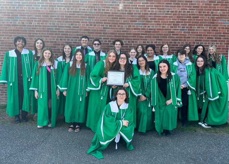 Group photo of students with award