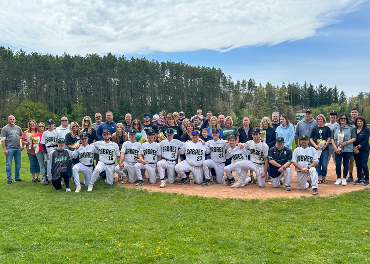 Group photo of baseball players and families