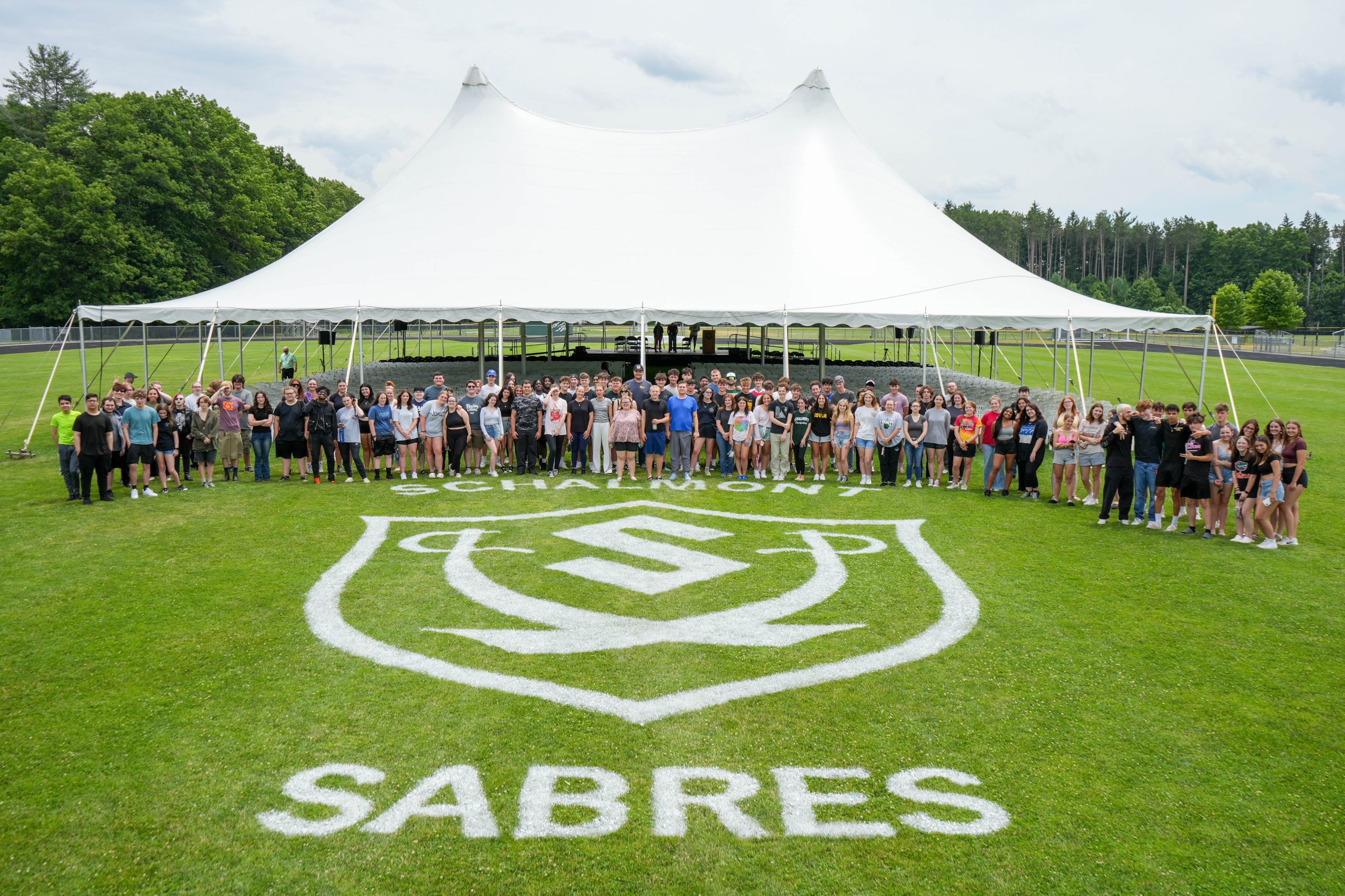 Group photo of students on field