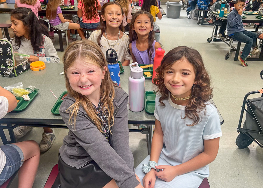 Students pose for photo at lunch