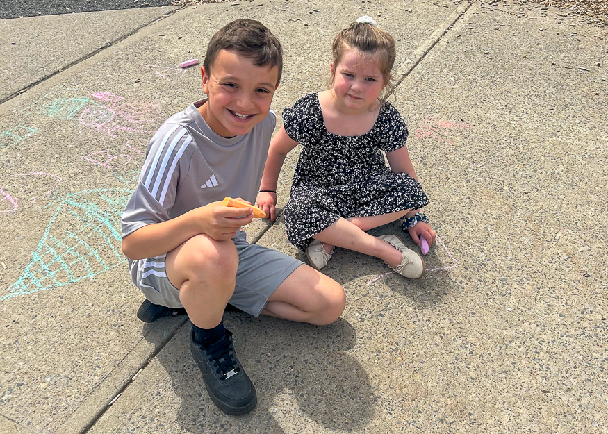 Students on playground pose for photo