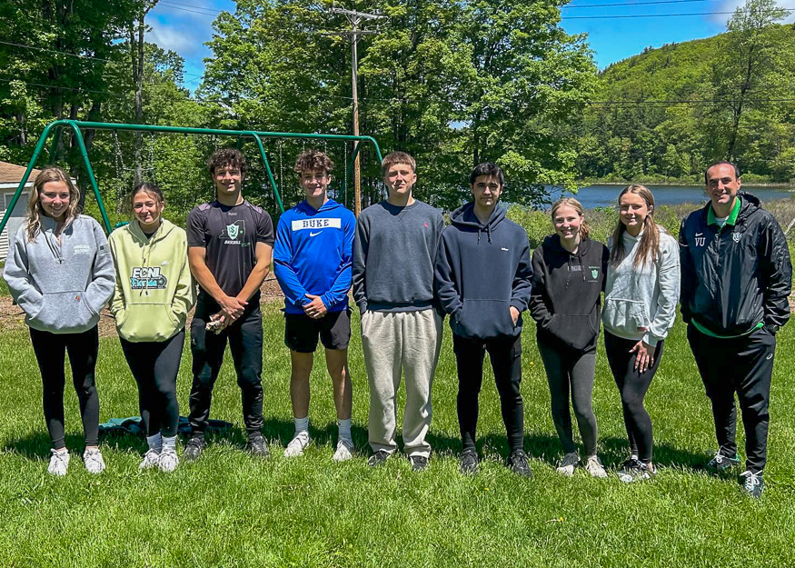 Students and coach pose for photo