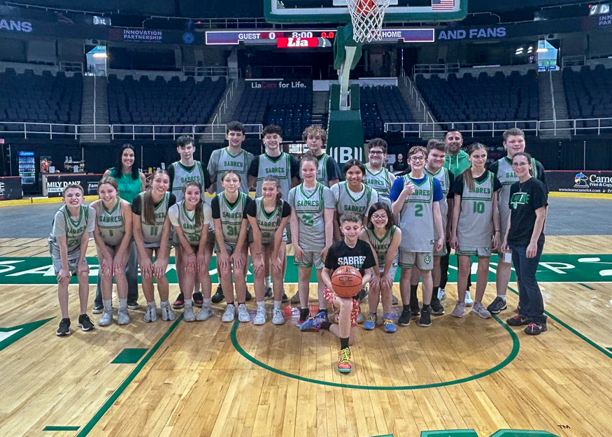 Basketball team poses for group photo