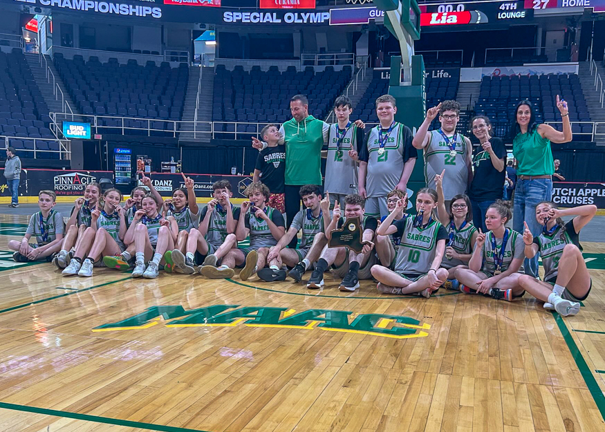 Basketball team poses for group photo