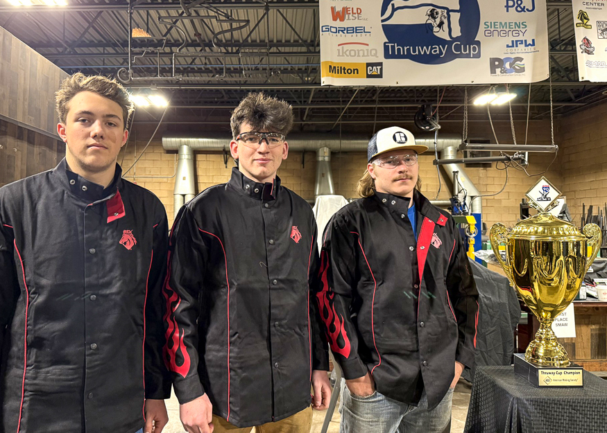 Welders with trophy