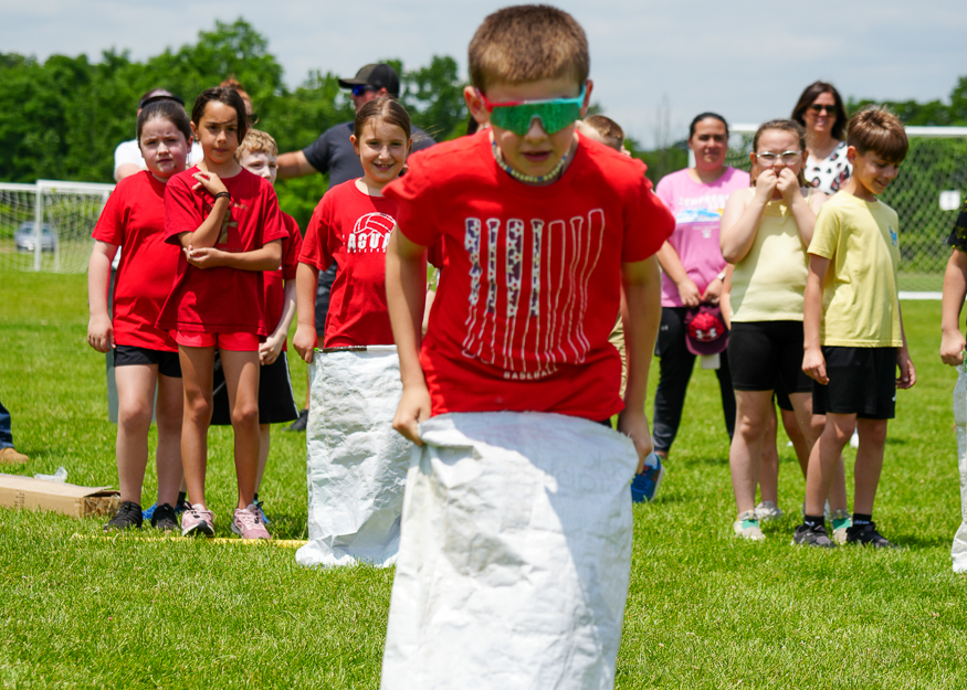 Student in sack race