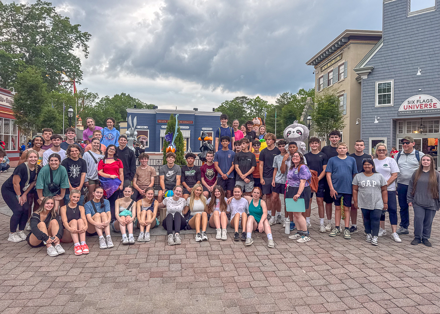 Group photo of students at amusement park
