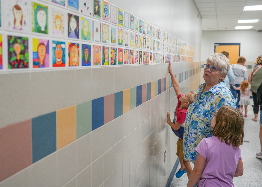 Community looks at school hallway