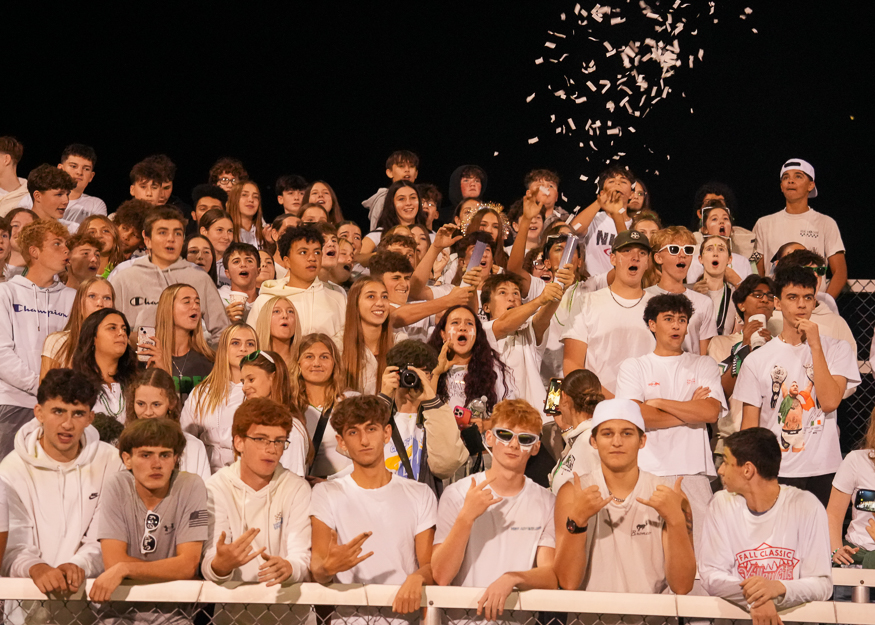 Students celebrate in bleachers