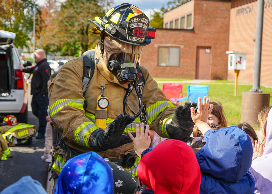 Students with firefighter