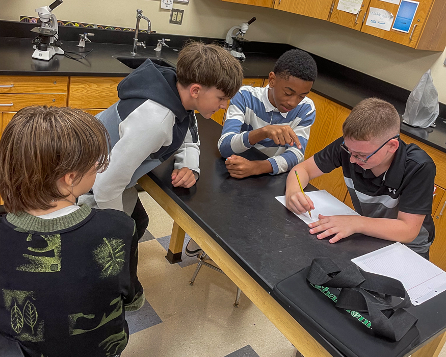 Students work together in class