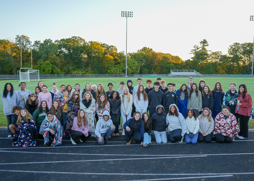 Group photo of students on track