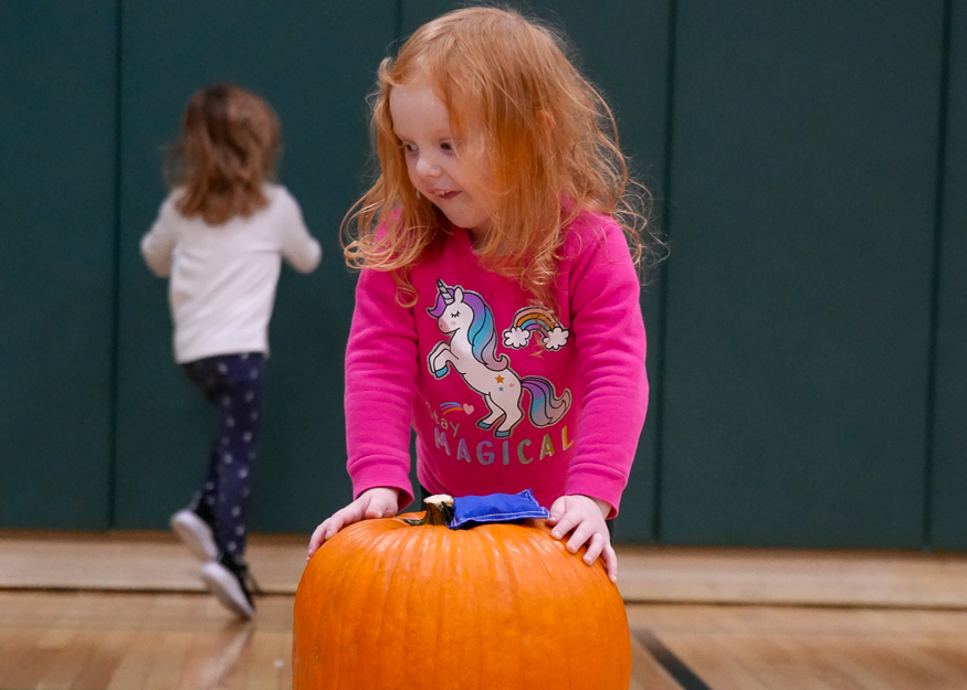 Student plays in gym