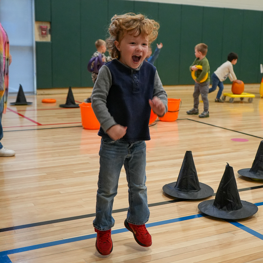 Student plays in gym