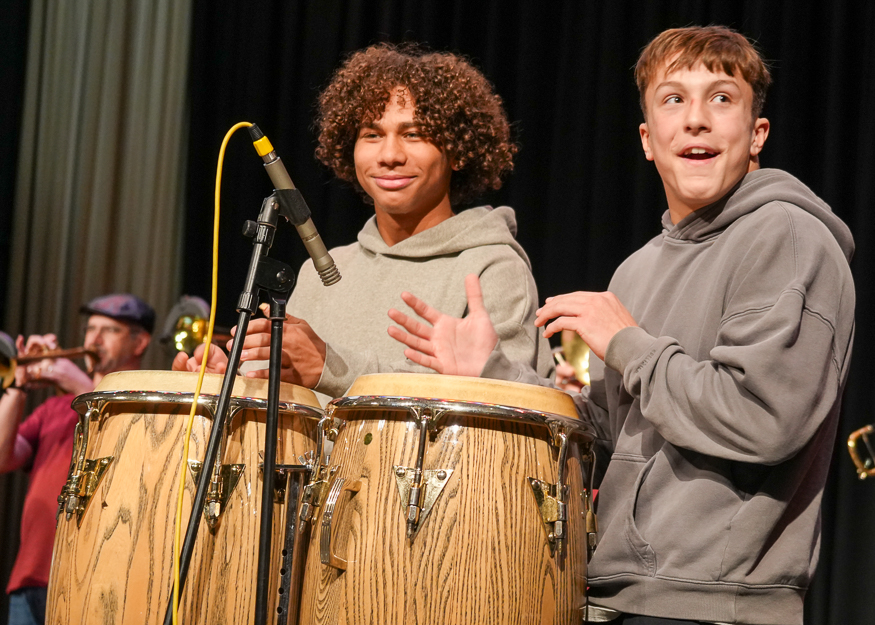 Students play congas