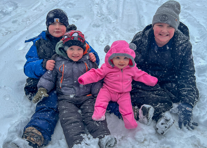 Family enjoys snow