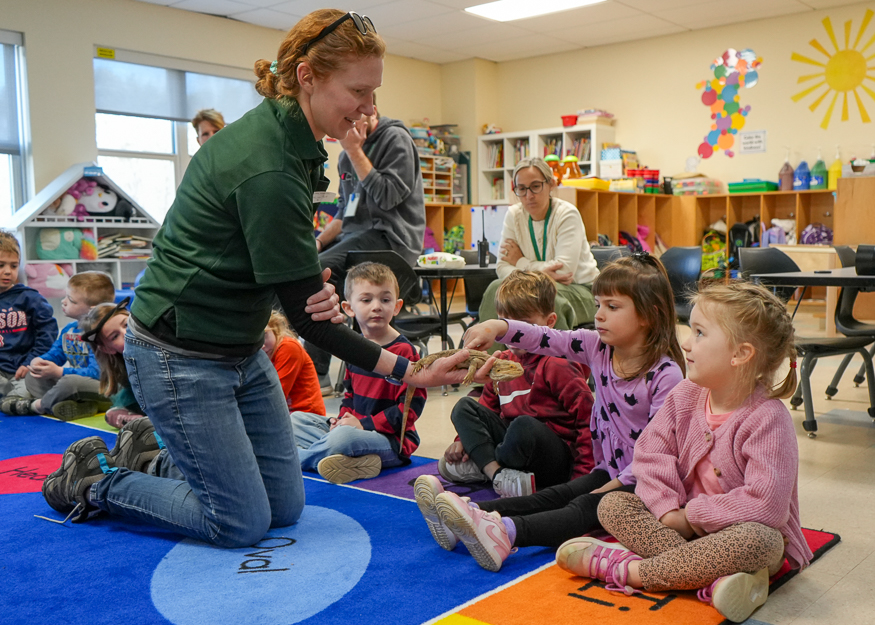 Student touches snake in class