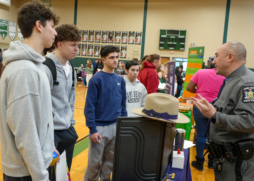 Students listen to state trooper