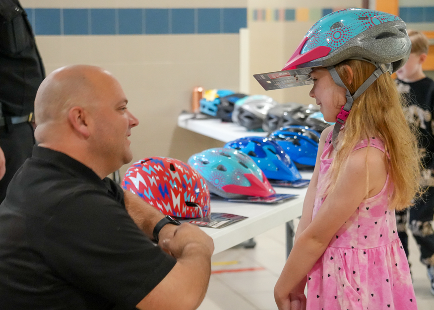 Police officer talks with student