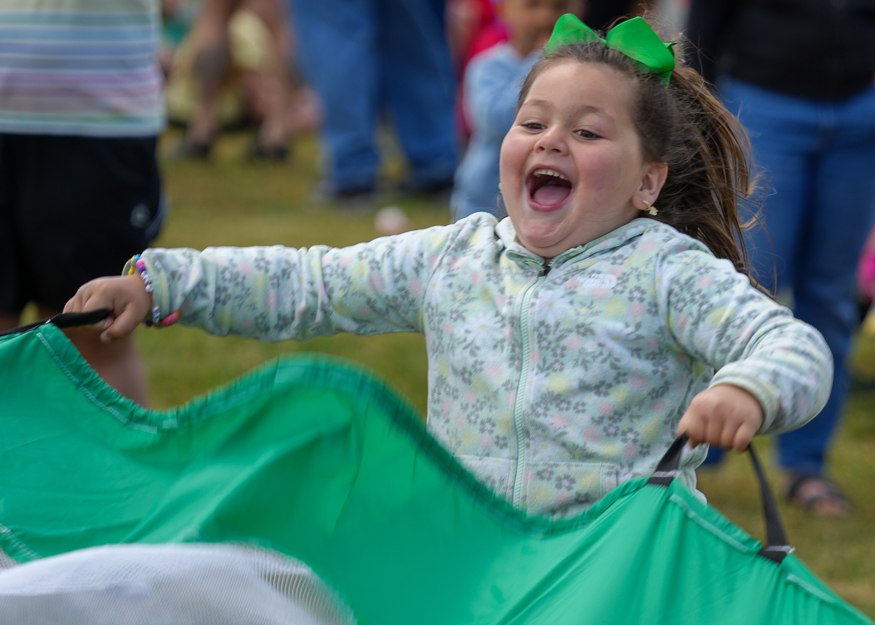 Student laughs with parachute