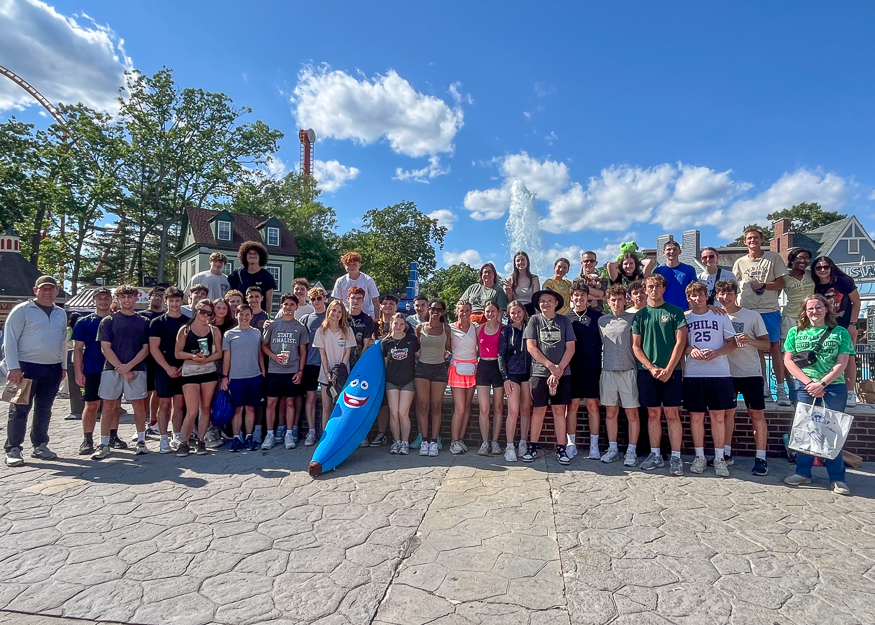 Group photo of students at amusement park