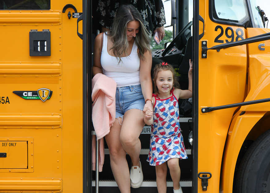 Student and parent come off bus