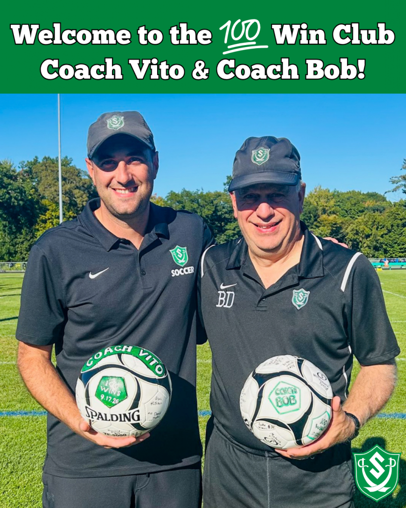 Coaches pose for photo with game balls