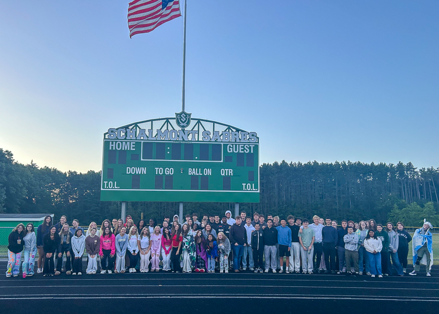 Group photo of students at sunrise